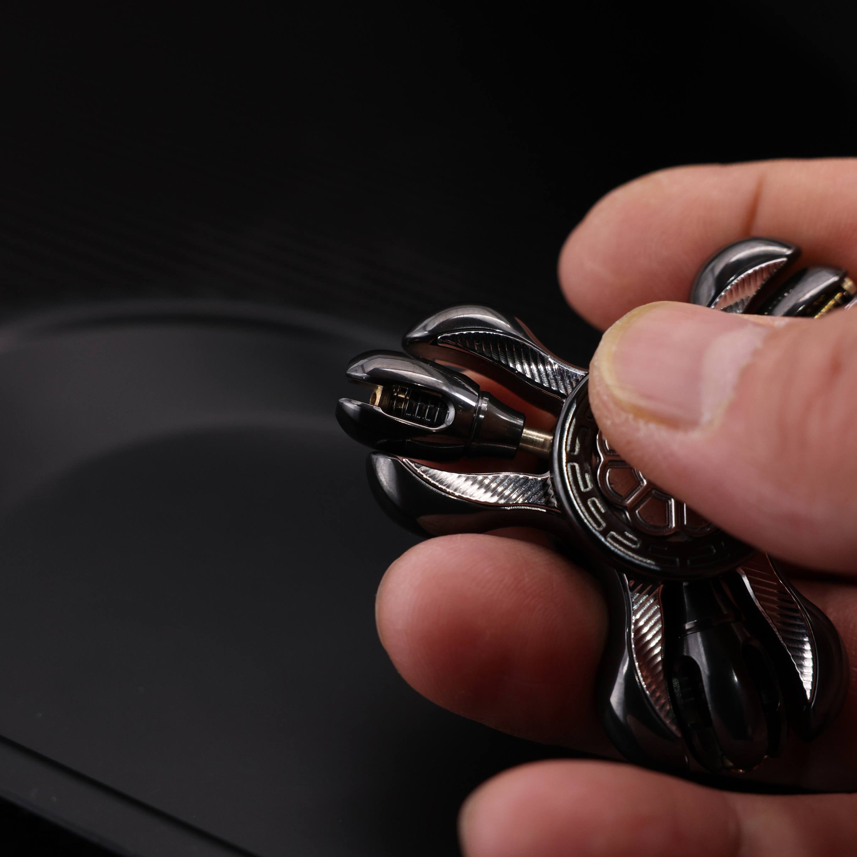 "Jinglun", a fingertip gyroscope with a polished zirconium alloy and stainless steel patch version by CHIMAGO EDC